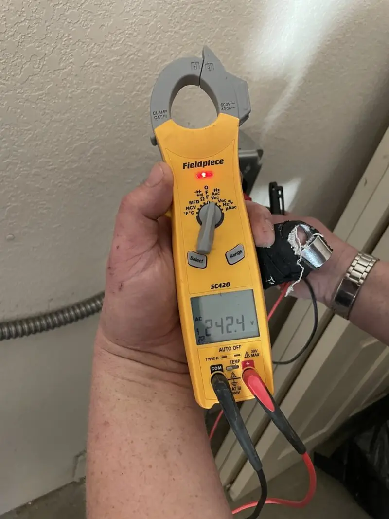 Voltage testing with clamp meter during Electrical Installation Services in Penns Grove